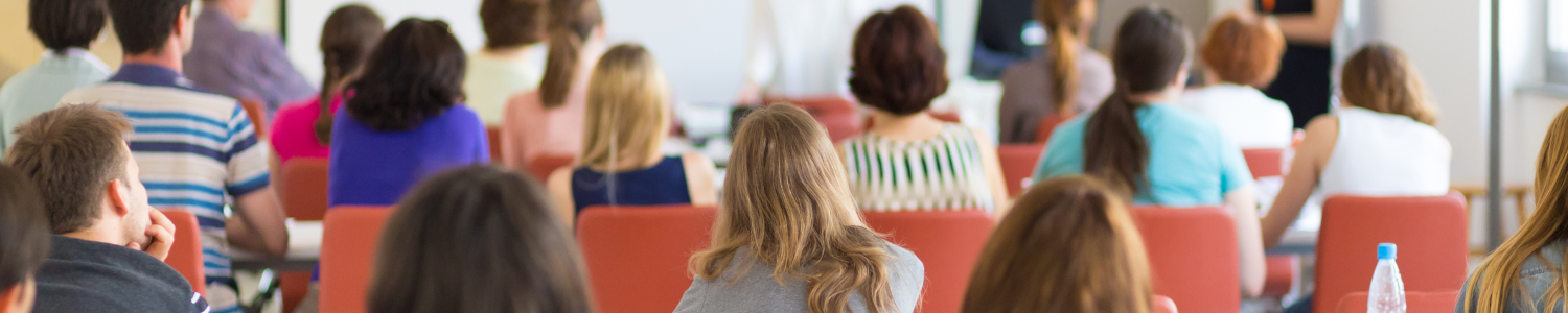 people sitting down attending event